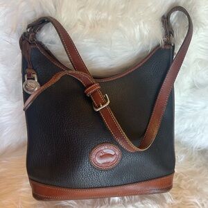 Dooney & Bourke Vintage Hobo Black and Tan Crossbody Shoulder Bag.  F